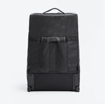 Back side view with the straps tucked in of the Roam Padded Roller Backpack